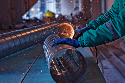 Ranka Steels workers loading steel materials onto trucks
